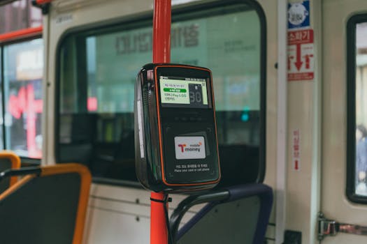 Card reader on a Seoul bus for convenient digital payments during city travel.